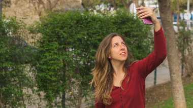 blonde girl takes a selfie