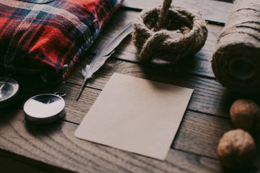 Hipster traveler hiking pack. Set for hiking in the mountains or forest. Scout concept. Rustic flat lay on a wooden table. Hipster lumberjack flat lay.	