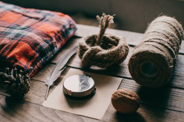 Hipster traveler hiking pack. Set for hiking in the mountains or forest. Scout concept. Rustic flat lay on a wooden table. Hipster lumberjack flat lay.	