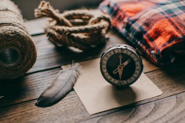 Hipster traveler hiking pack. Set for hiking in the mountains or forest. Scout concept. Rustic flat lay on a wooden table. Hipster lumberjack flat lay.	