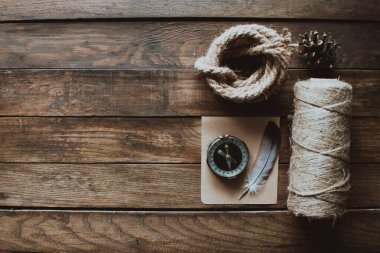 Hipster traveler hiking pack. Set for hiking in the mountains or forest. Scout concept. Rustic flat lay on a wooden table. Hipster lumberjack flat lay.	