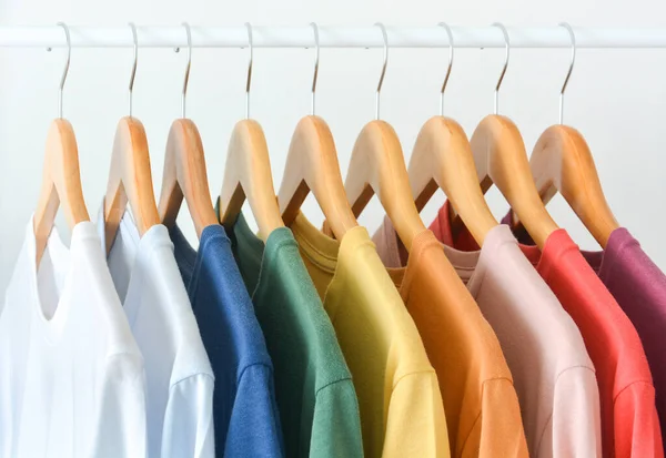 Close Collection Pastel Color Shirts Hanging Wooden Clothes Hanger Closet — Zdjęcie stockowe