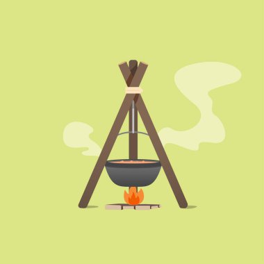 Şenlik ateşinde siyah bir kazan. Kamp yapmak. Fırlat. Yeşil bir arkaplanda izole edilmiş