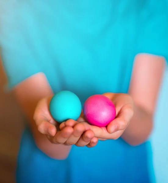 Multicolored Easter eggs in hands