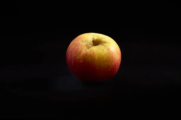 Fresh natural delicious apple on black background