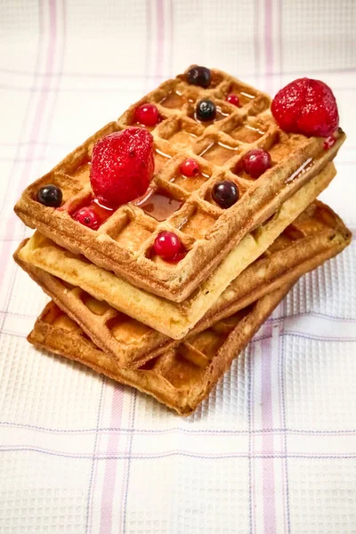Belgian waffles with berries on a fabric background. — Stock Photo, Image