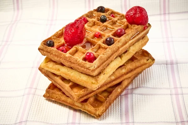 Belgian waffles with berries on a fabric background. — Stock Photo, Image