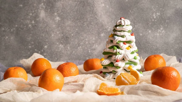Tangerines, clementines, mandarins scattered on table. Holiday mood. Festive Christmas shaped treats. Sweet Xmas — Stock Photo, Image