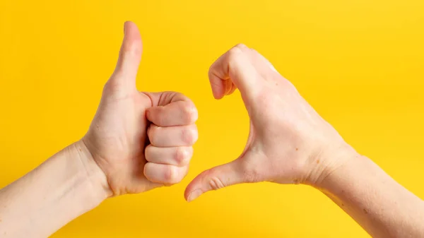 Friendzone hand sign on yellow background. Friend zone symbol. Friendzoned hands shape