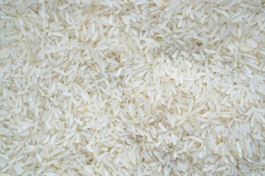 Asya beyaz pirinci ya da pişmemiş beyaz pirinç. Yasemin pilavı. Ham beyaz pirinç arkaplan tam çerçeve