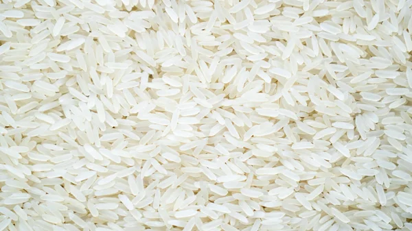 바스카 리 쌀을 배경으로 한다. 쟈스민 쌀밥의 상세 한 질감 배경, 쌀 배경의 근접 사진 — 스톡 사진