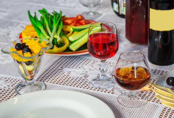 Glass of wine with fruit — Stock Photo, Image