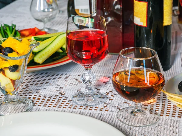 Glass of wine with fruit — Stock Photo, Image