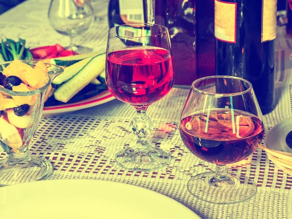 Glass of wine with fruit — Stock Photo, Image