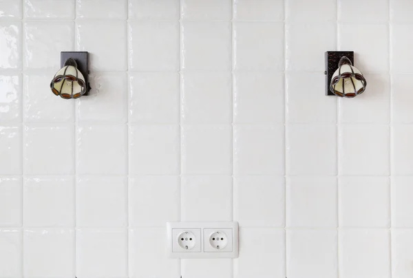 Fragment of wall tiles, sconce — Stock Photo, Image
