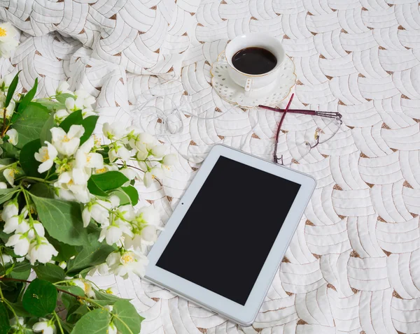 morning. jasmine flowers and coffee in bed
