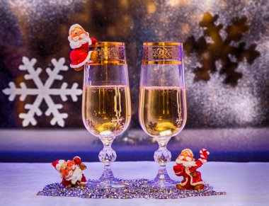 Christmas. champagne, toys gnomes.