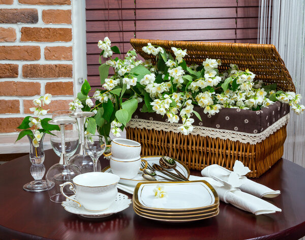 tableware and jasmine flowers in the interior