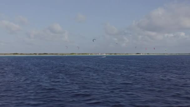 Bonaire Caribbean Netherlands Aerial V22 Fast Panning Kiteboarders January 2019 — Stock Video