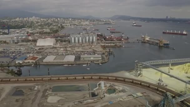 Vancouver Canada Aerial V30 Crossing Looking Back Industrial Shipping Terminal — Stock video