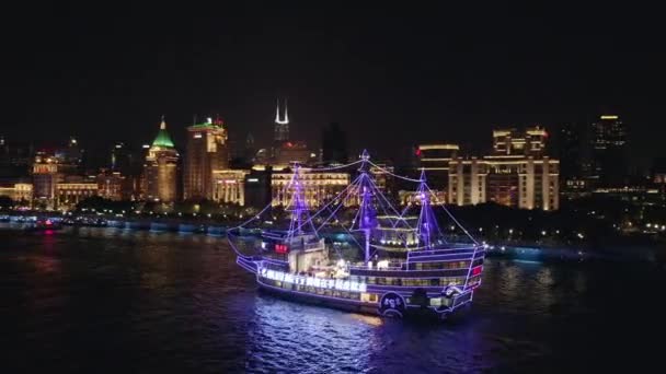 Shanghai China Aerial V145 Panning Purple Lighted Ship Night Bund — Stock Video