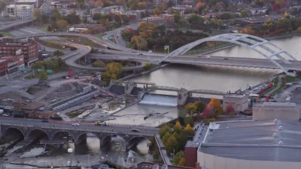 Rochester New York Aerial V34 Traversing Bridge River Cityscape Sunrise — Stock Video