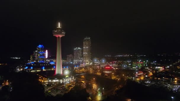 Niagara Falls Ontario Aerial V27 Low Vantage Nighttime Panoramic Cityscape — Stock Video