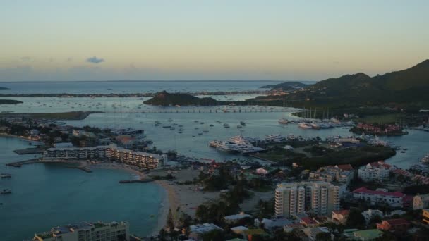 Maartin Aerial V65 Flying Low Simpson Bay Town Panning Sunset — Stock Video