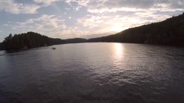 Aerial over lake during sunset. — Stock Video