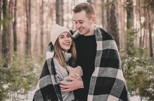 Man Hugs Woman Covered Blanket Background Winter Pine Forest — Stock Photo, Image