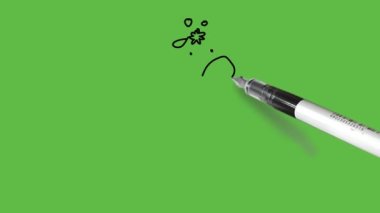 Soyut yeşil arkaplanda siyah, kahverengi ve sarı renkli bir zürafa çiziyor.