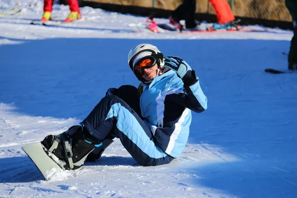 Girl snowboarder on the snow