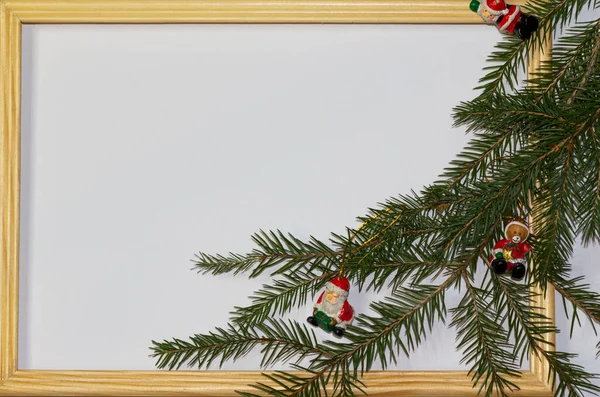 Christmas or winter composition. Santas red hat, white background, wooden rustic frame, with spruce branch decoration. Christmas background, Christmas, winter, new year concept. Flat lay, top view — Stock Photo, Image