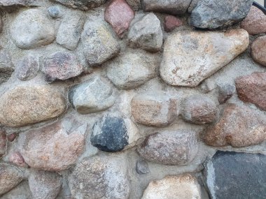 Çimentolu gri taş duvar, eski bir binanın dış duvarı, arka plan