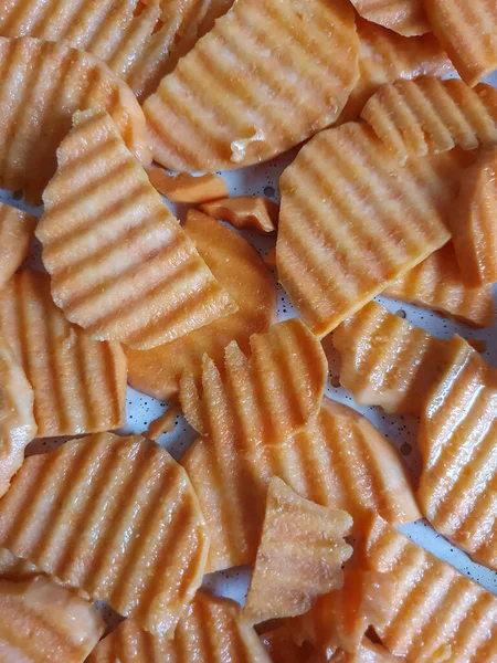 sweet potatoes, sweet potatoes cut, sprinkled with oil and ready to bake food background, food and drink