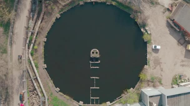 A round reservoir at the heat power station. looks like a smile. Industrial city — Stock Video