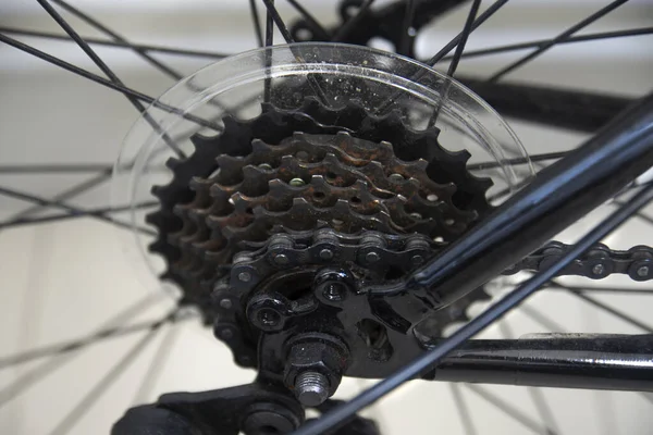 bicycle gear speed that is worn and rusty but can still be used.