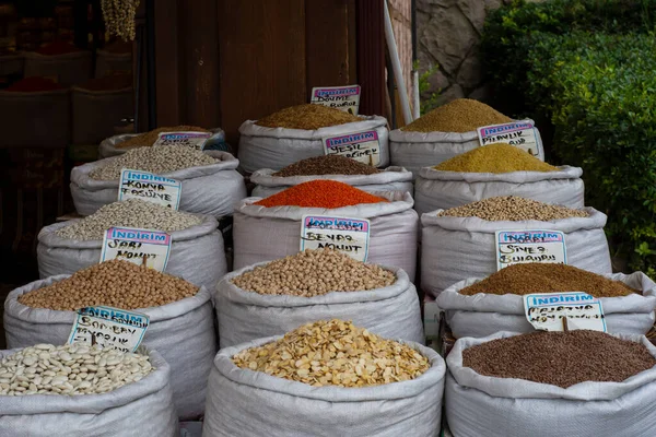 exhibition area of a shop where pulses are sold in sacks. chickpeas, dried beans, bulgur, lentils, pumpkin seeds, etc.