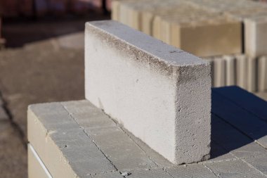 İnşaat için tuğla satışı. İnşaat malzemelerinin toptan satış tabanı. Arkaplan