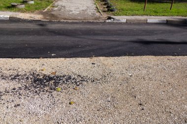 Soyut yol onarımı geçmişi. Asfalt yenileme. Yol yüzeyi güncelleniyor.