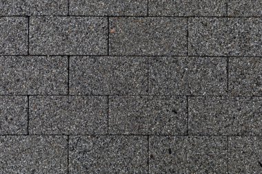 Şehir ortamındaki kaldırım levhalarının pürüzlü dokusu. Arkaplan kapat