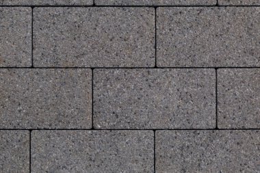 Şehir ortamındaki kaldırım levhalarının pürüzlü dokusu. Arkaplan kapat