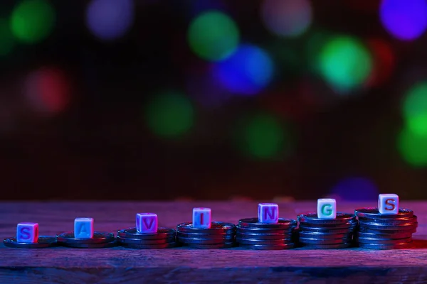 SAVINGS cubes with text in neon street cyber world of darkness. Atmospheric concept. Abstract background