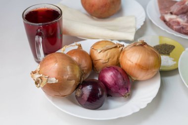 Lots of onions. Raw ingredients for home cooking. Selective focus