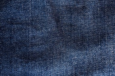 Denim. Arkaplan olarak pürüzlü dokulu yüzey ya da tasarım için boş. Grafiksel kaynak.