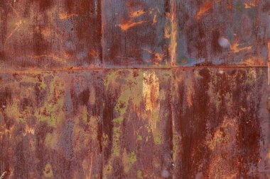 Eski paslı metalin pürüzlü yüzeyi ve soyulmuş boya. Arkaplan