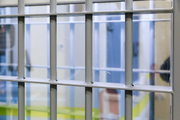 Typical modern prison bars. Symbolic illustrative background for crime news.