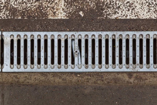 Drainage grates in an urban environment. Abstract background with copy space for text