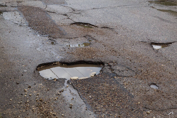 Bad bumpy road. Background with copy space for text or inscriptions.