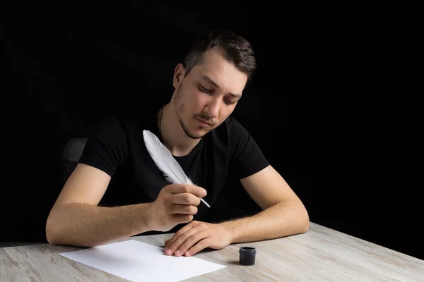 Young Handsome Man Black Clothes Quill Pen Pensive Romantic Looks — Stock Photo, Image